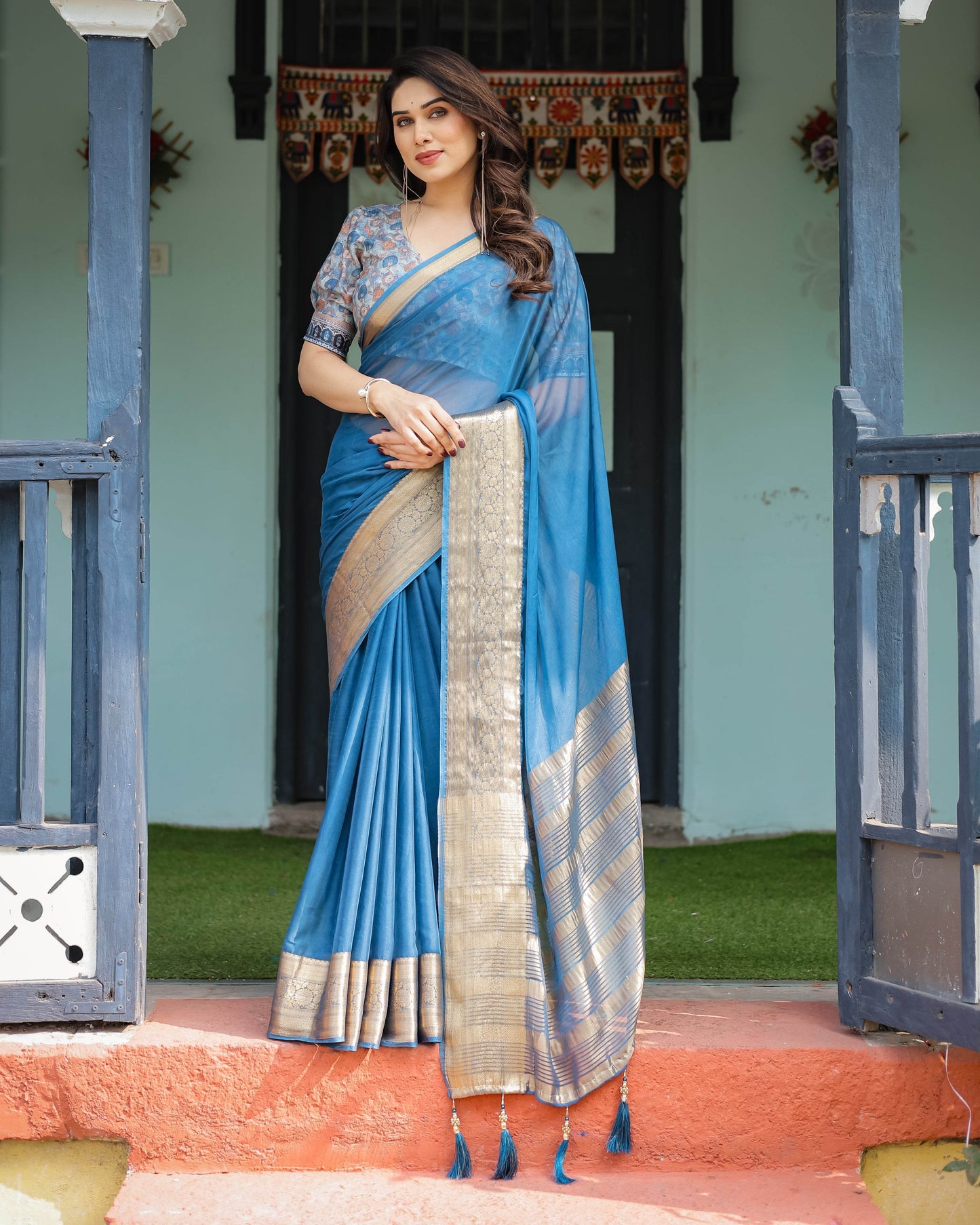 Vibrant Peacock Blue Plain Chiffon Saree with Gold Zari Border, Floral Printed Blouse & Tassel Accents - SEEANS