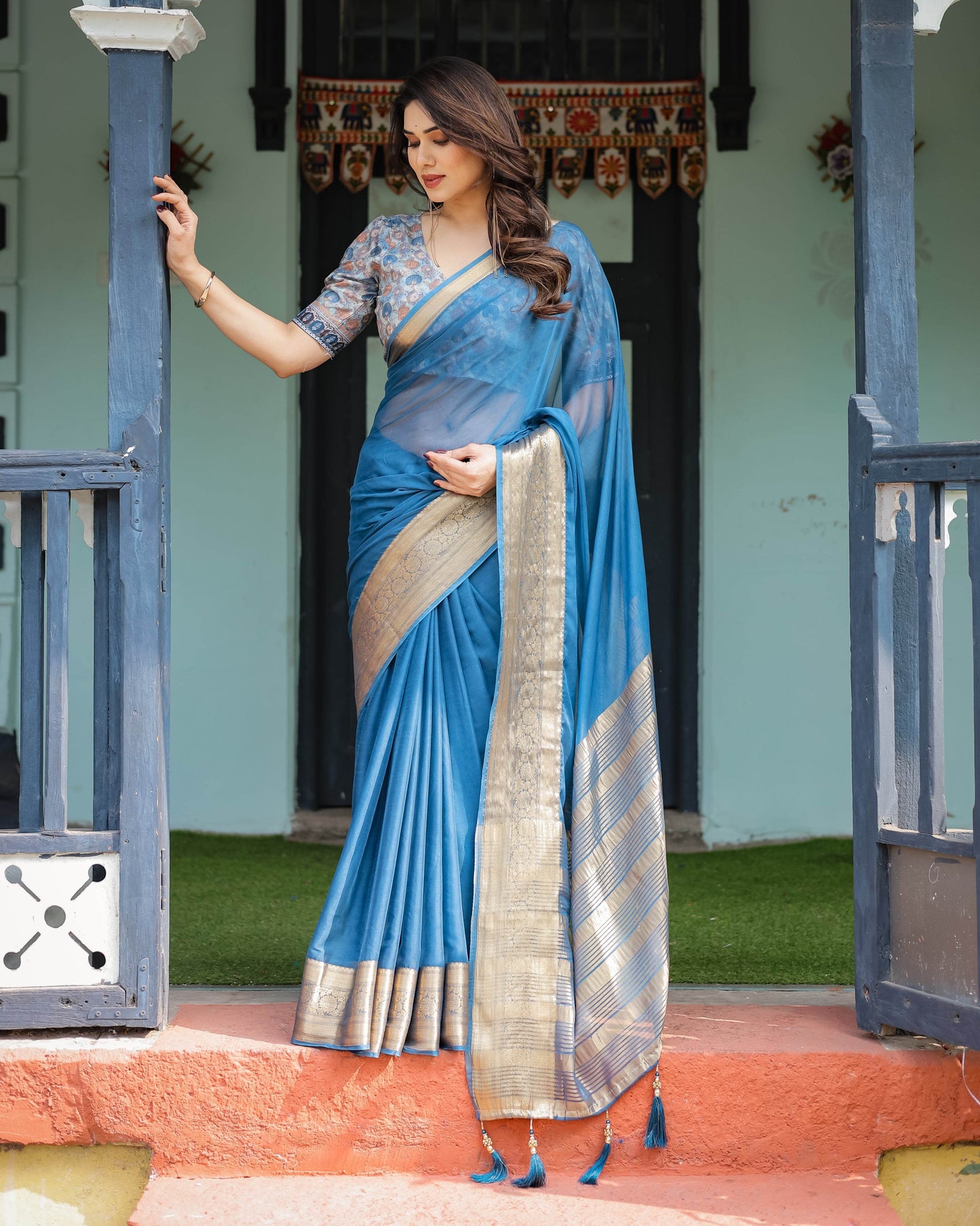 Vibrant Peacock Blue Plain Chiffon Saree with Gold Zari Border, Floral Printed Blouse & Tassel Accents - SEEANS
