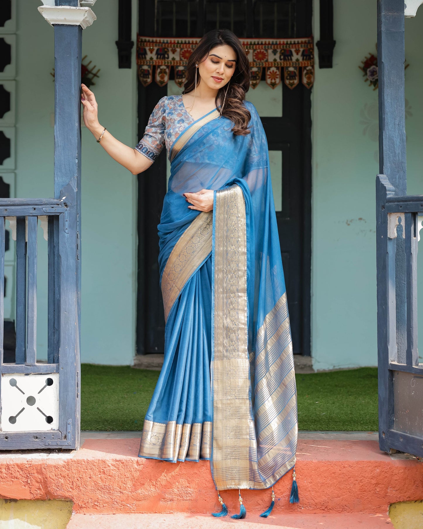 Vibrant Peacock Blue Plain Chiffon Saree with Gold Zari Border, Floral Printed Blouse & Tassel Accents - SEEANS