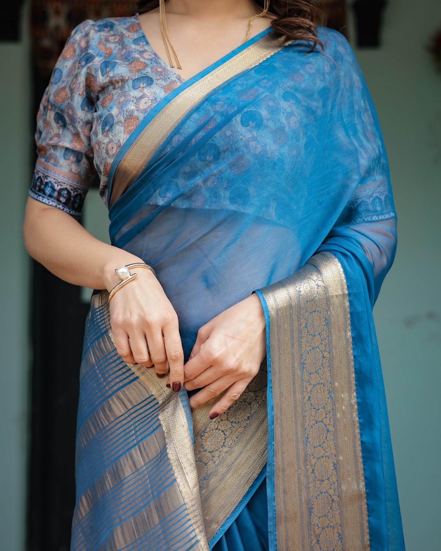 Vibrant Peacock Blue Plain Chiffon Saree with Gold Zari Border, Floral Printed Blouse & Tassel Accents - SEEANS