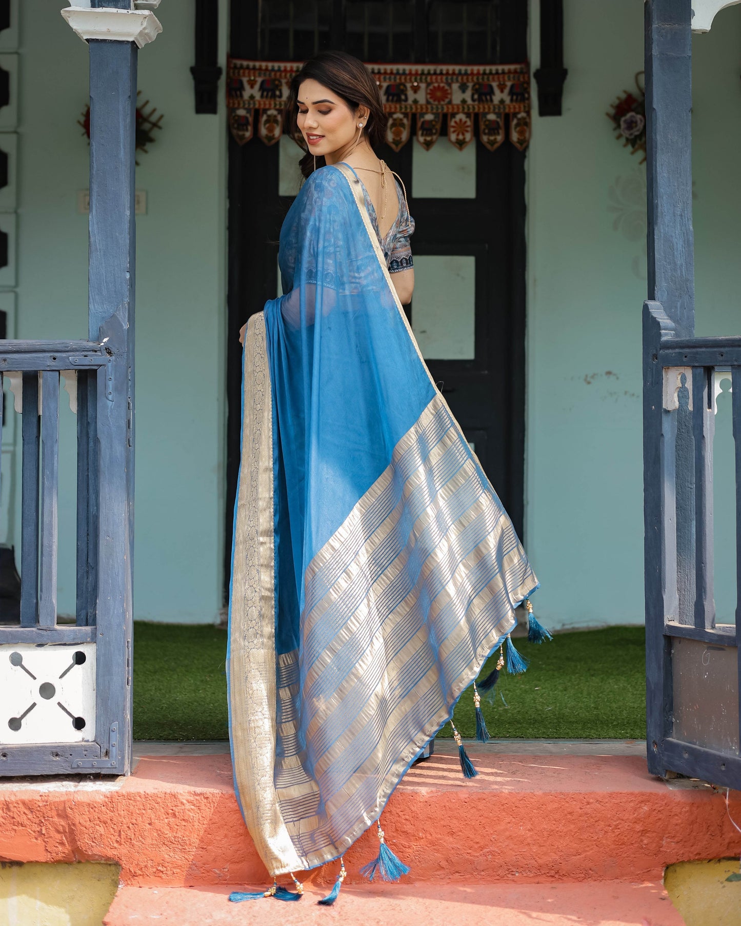 Vibrant Peacock Blue Plain Chiffon Saree with Gold Zari Border, Floral Printed Blouse & Tassel Accents - SEEANS