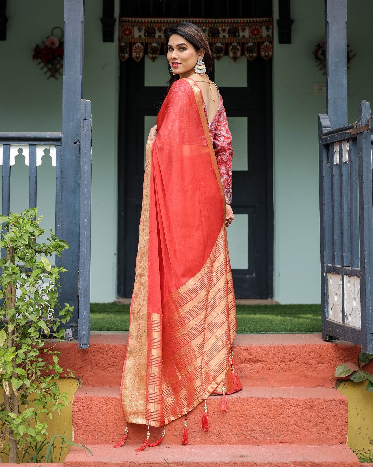 Fiery Red Plain Chiffon Saree with Gold Zari Border, Full-Sleeve Floral Blouse & Tassel Detailing - SEEANS
