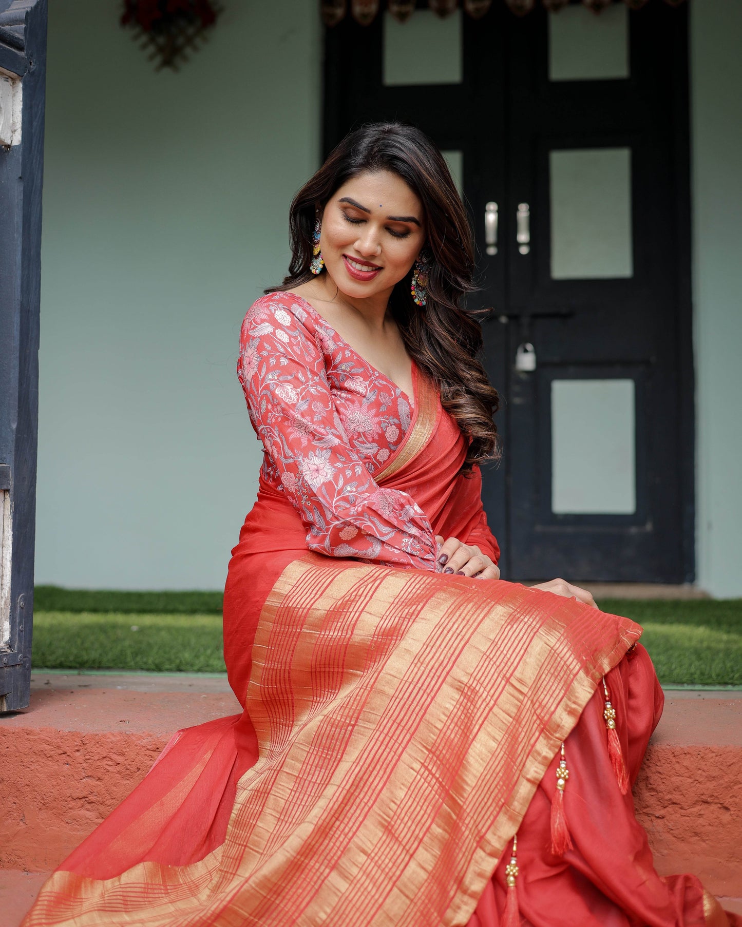 Fiery Red Plain Chiffon Saree with Gold Zari Border, Full-Sleeve Floral Blouse & Tassel Detailing - SEEANS