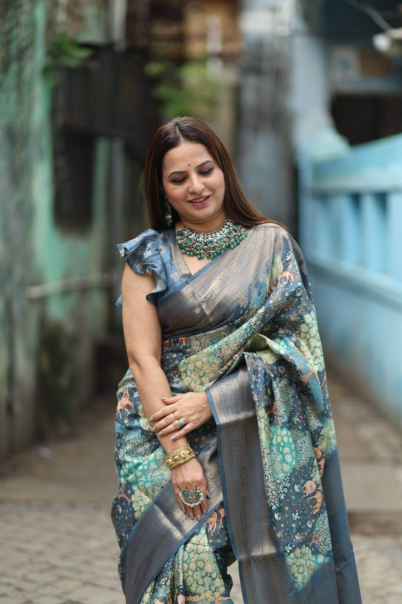 Elegant Teal Blue Banarasi Silk Saree with Forest-Inspired Motifs and Tassels - SEEANS