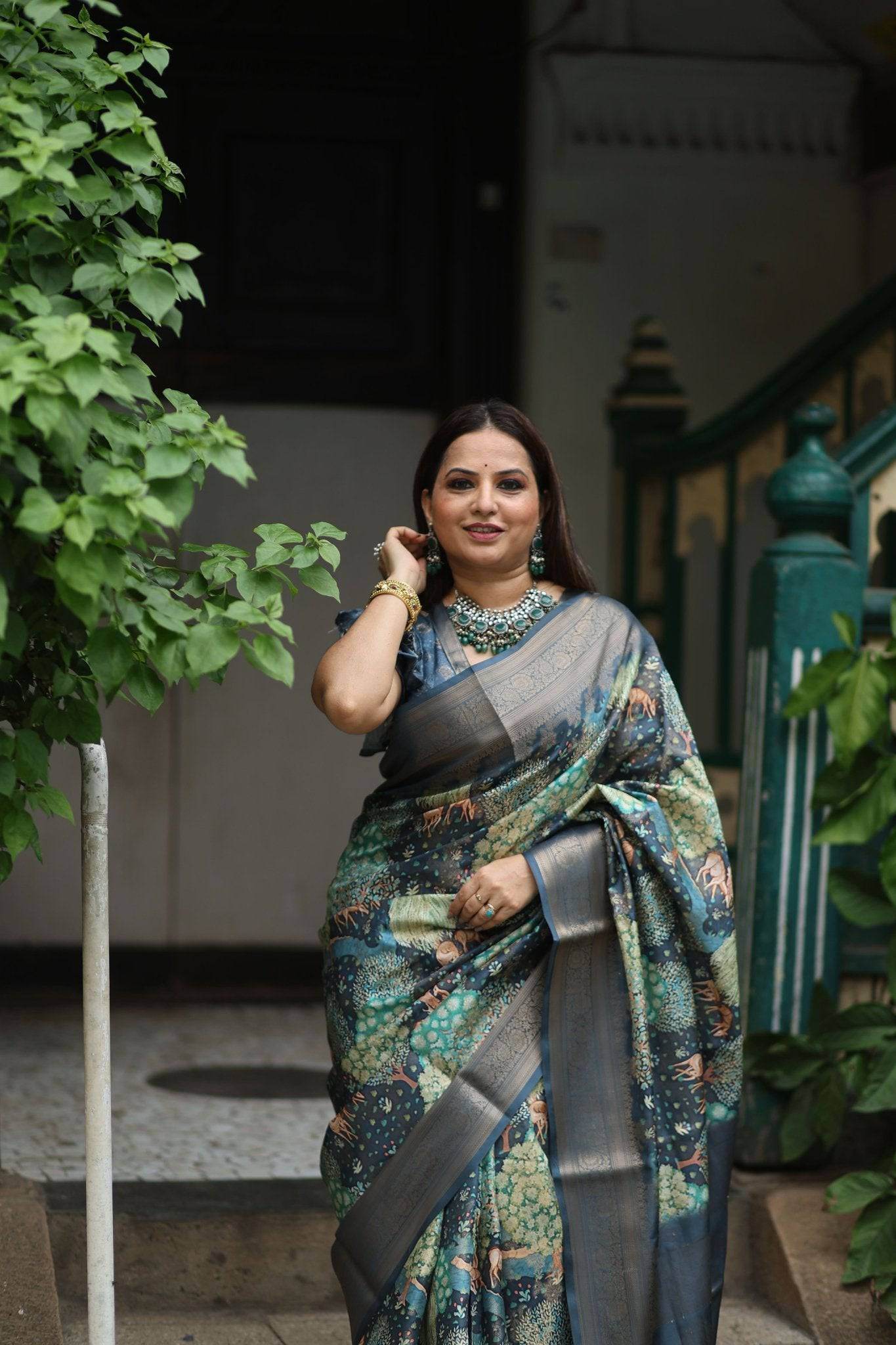 Elegant Teal Blue Banarasi Silk Saree with Forest-Inspired Motifs and Tassels - SEEANS