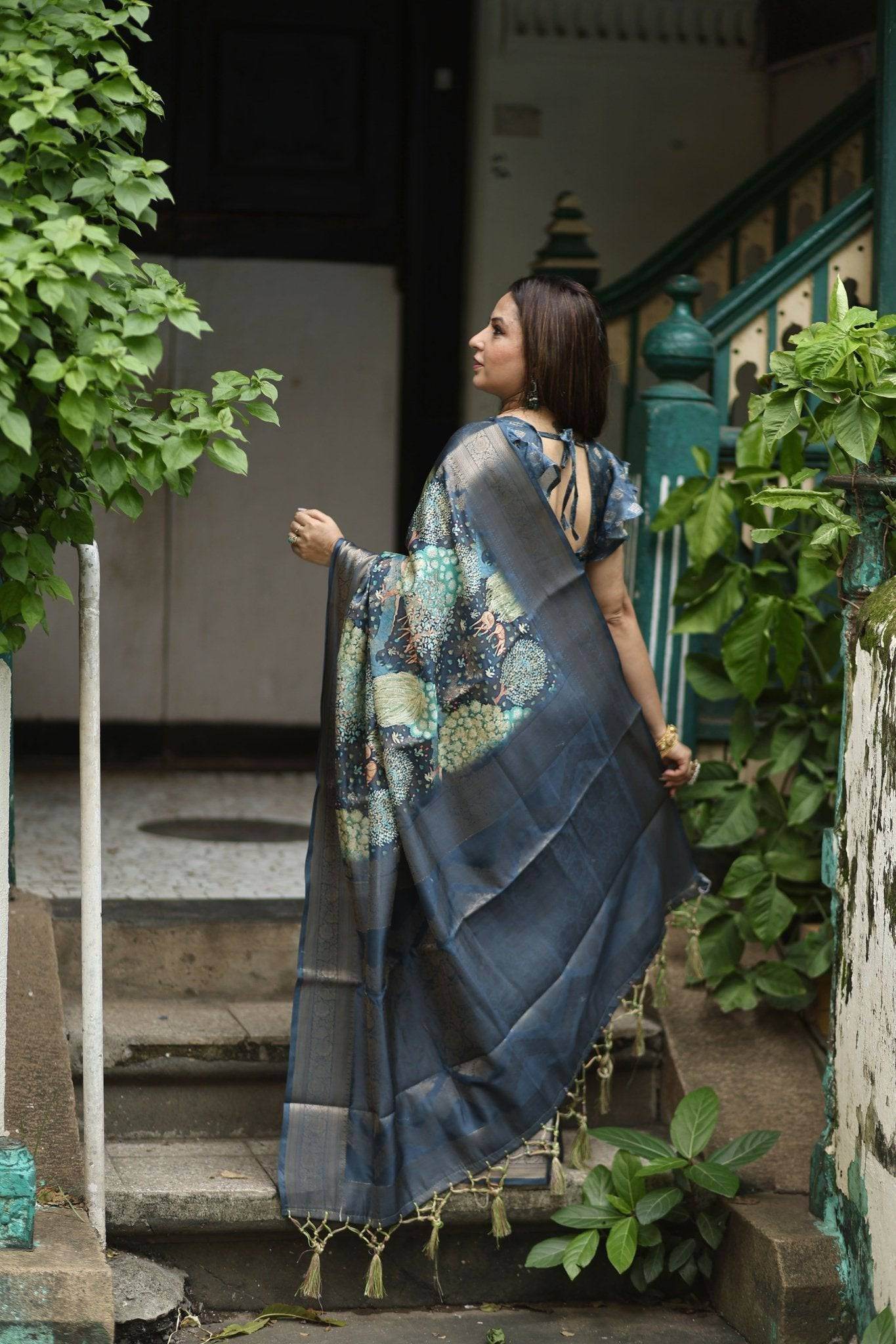 Elegant Teal Blue Banarasi Silk Saree with Forest-Inspired Motifs and Tassels - SEEANS