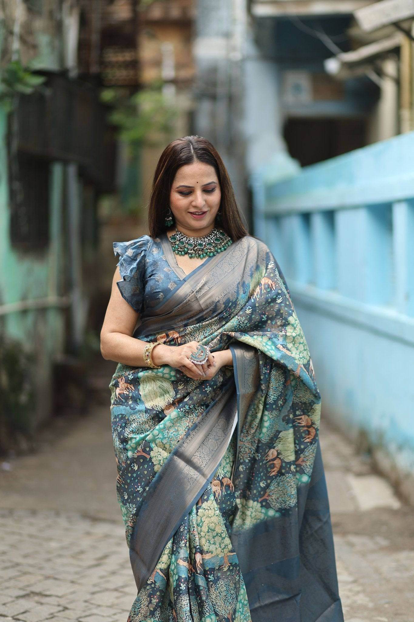 Elegant Teal Blue Banarasi Silk Saree with Forest-Inspired Motifs and Tassels - SEEANS