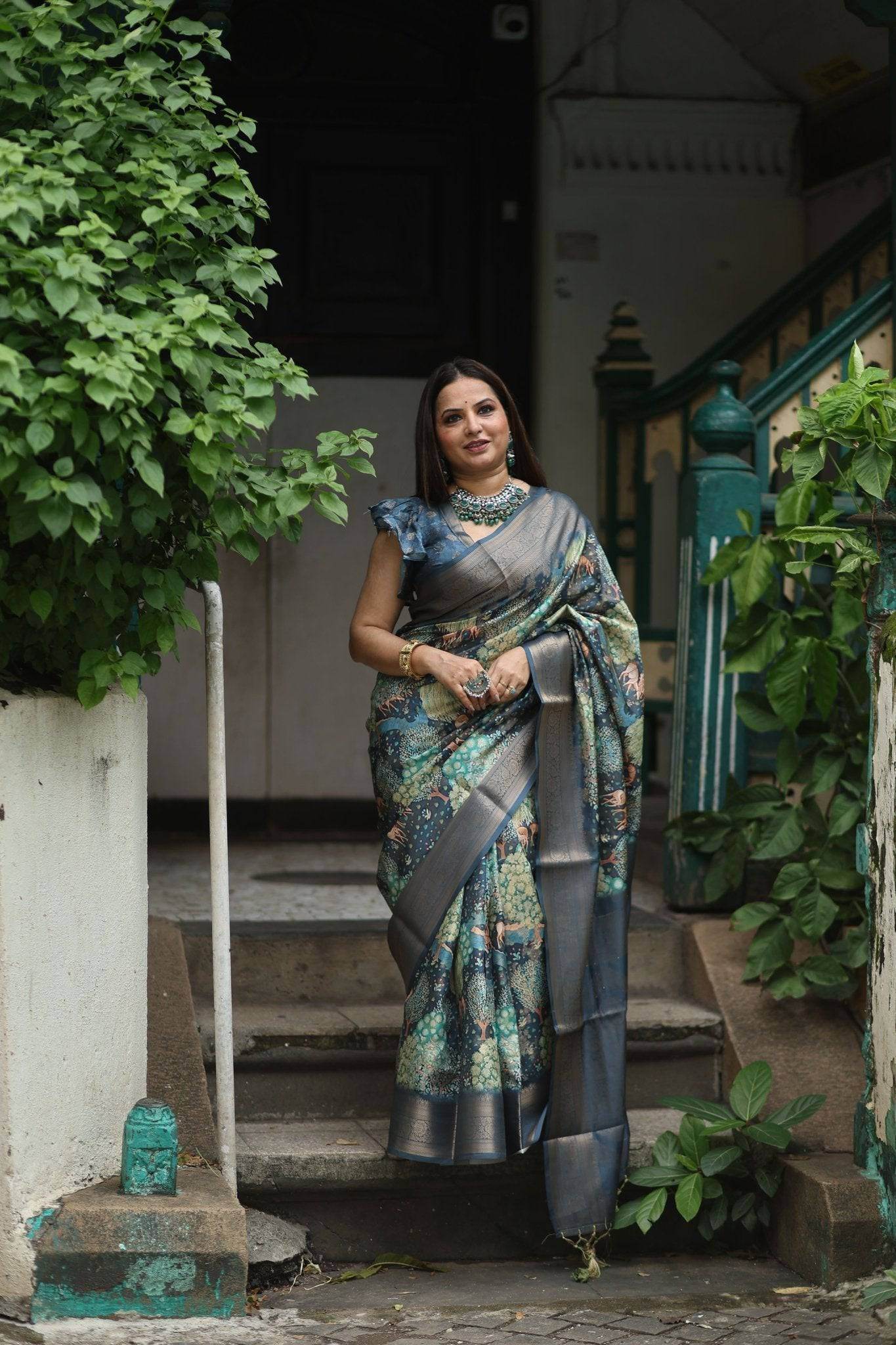 Elegant Teal Blue Banarasi Silk Saree with Forest-Inspired Motifs and Tassels - SEEANS
