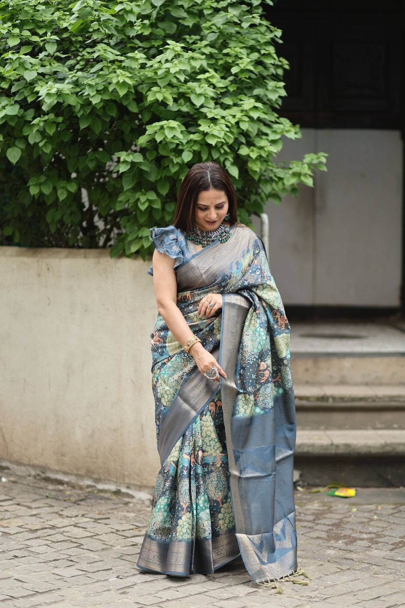 Elegant Teal Blue Banarasi Silk Saree with Forest-Inspired Motifs and Tassels - SEEANS
