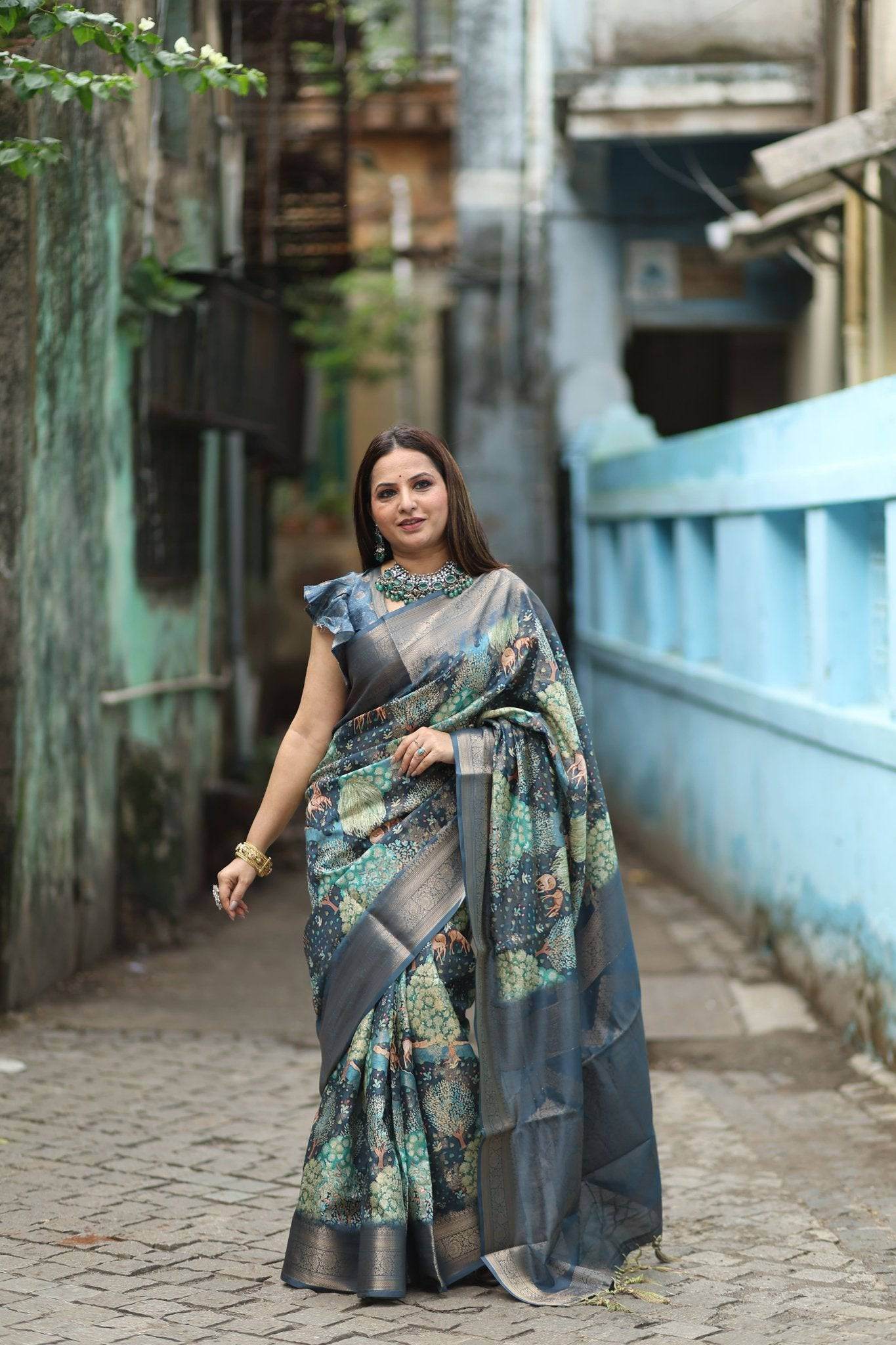 Elegant Teal Blue Banarasi Silk Saree with Forest-Inspired Motifs and Tassels - SEEANS