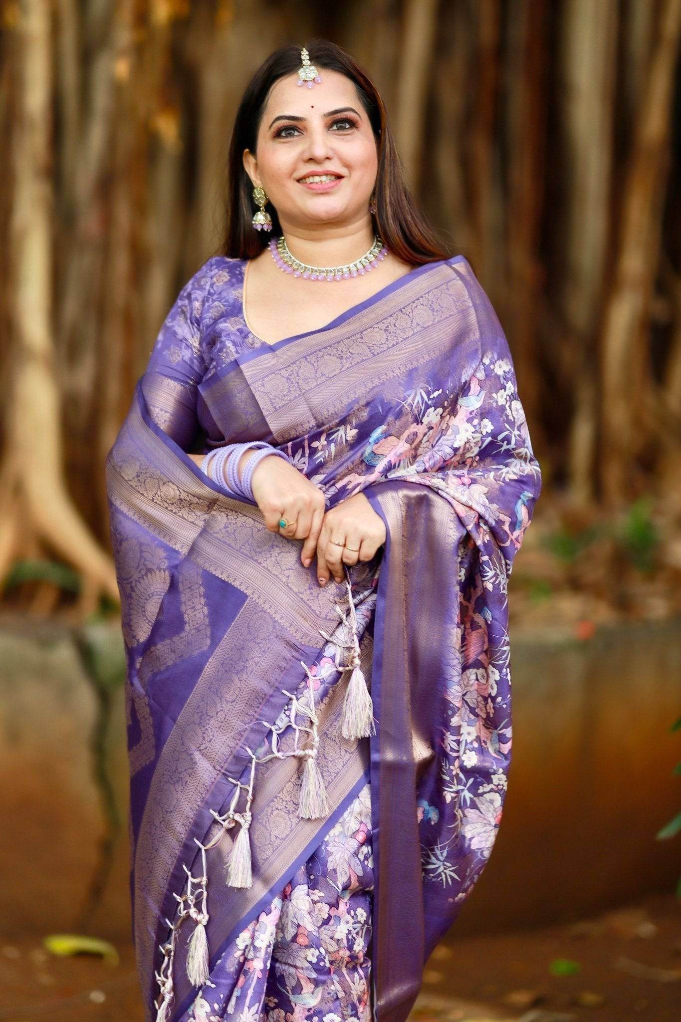Regal Purple Banarasi Silk Saree with Floral Motifs and Elegant Tassels - SEEANS