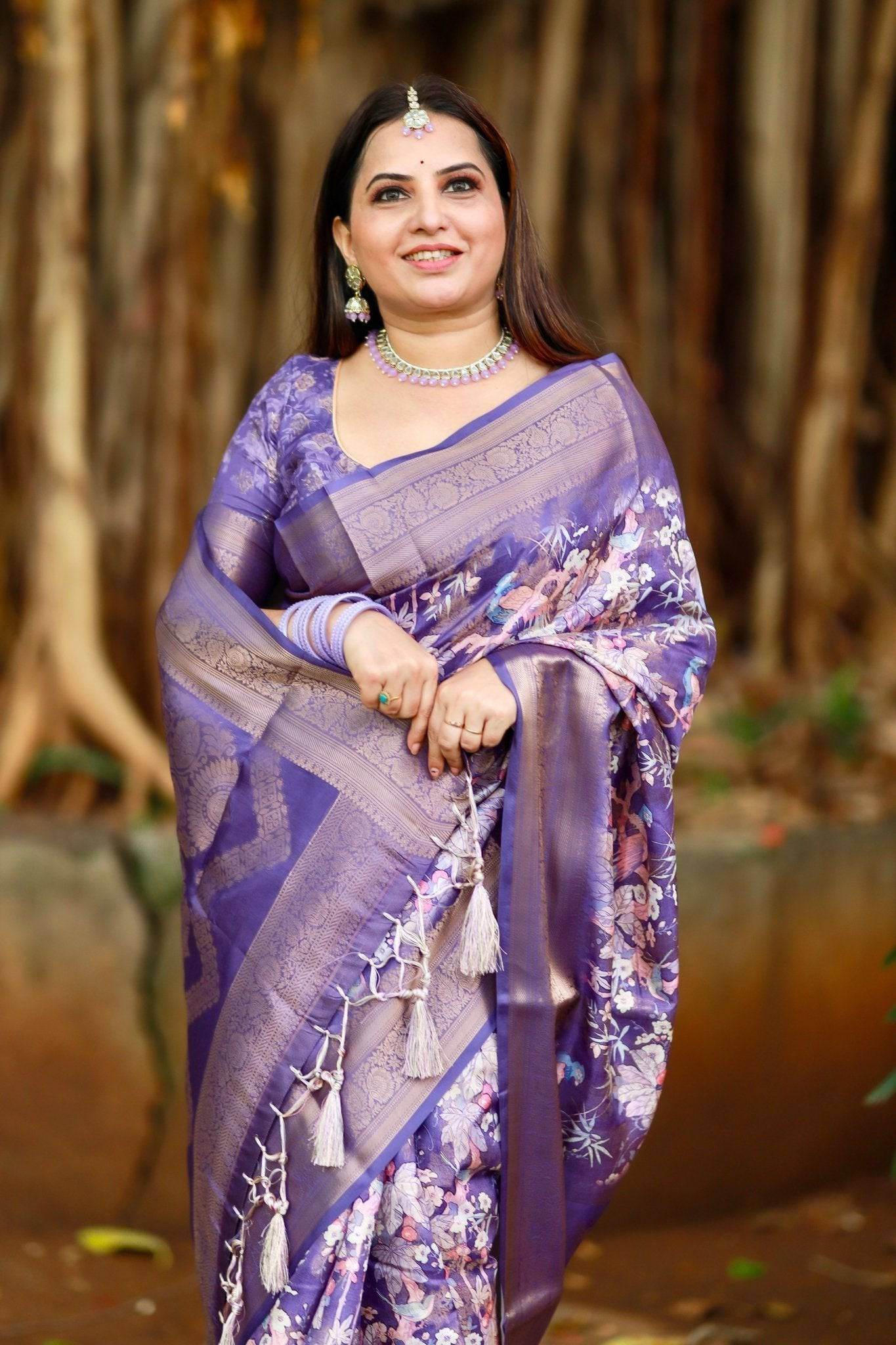 Regal Purple Banarasi Silk Saree with Floral Motifs and Elegant Tassels - SEEANS