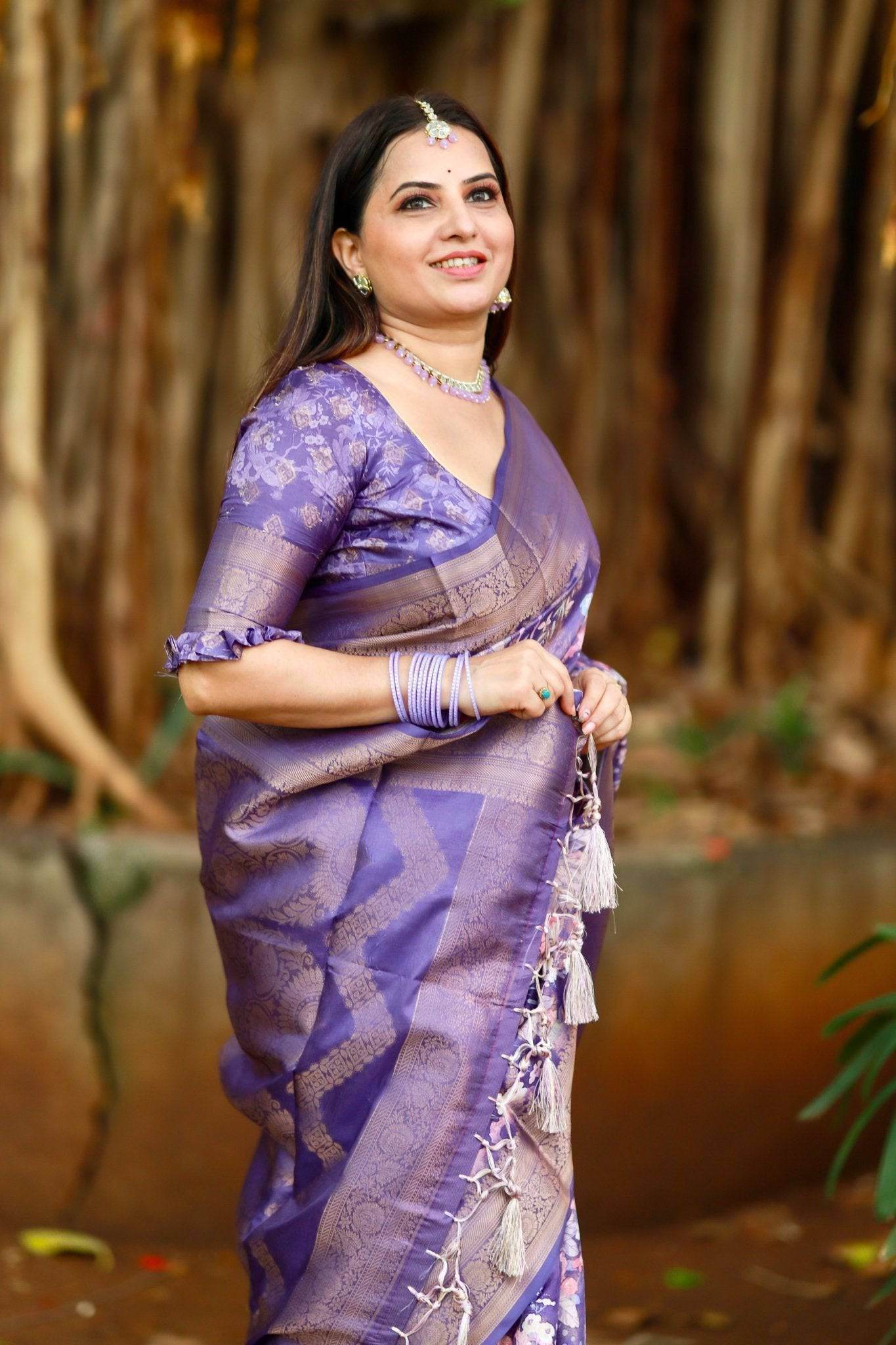 Regal Purple Banarasi Silk Saree with Floral Motifs and Elegant Tassels - SEEANS