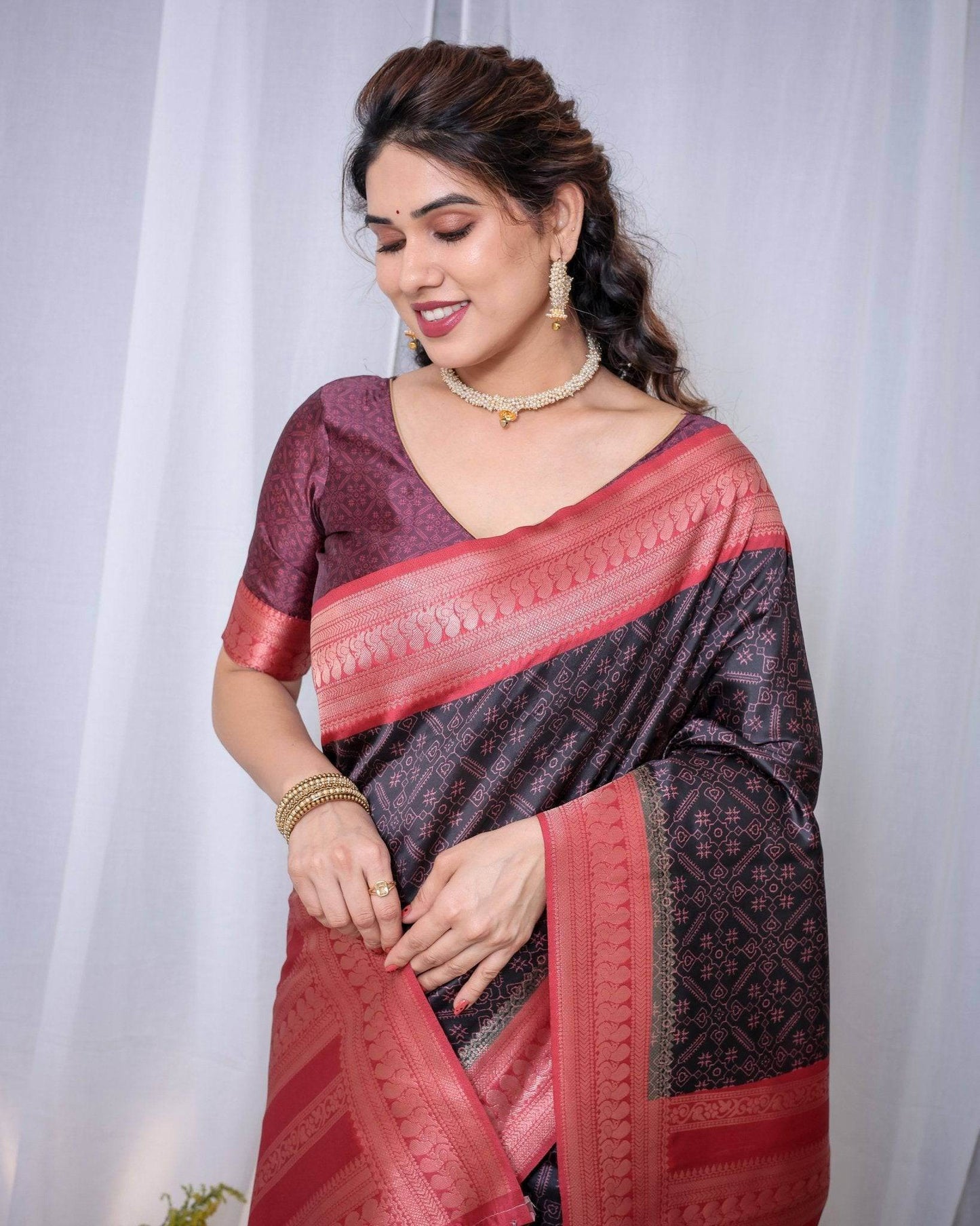 Majestic Black Banarasi Silk Saree with Rose Gold Border and Tassels - SEEANS