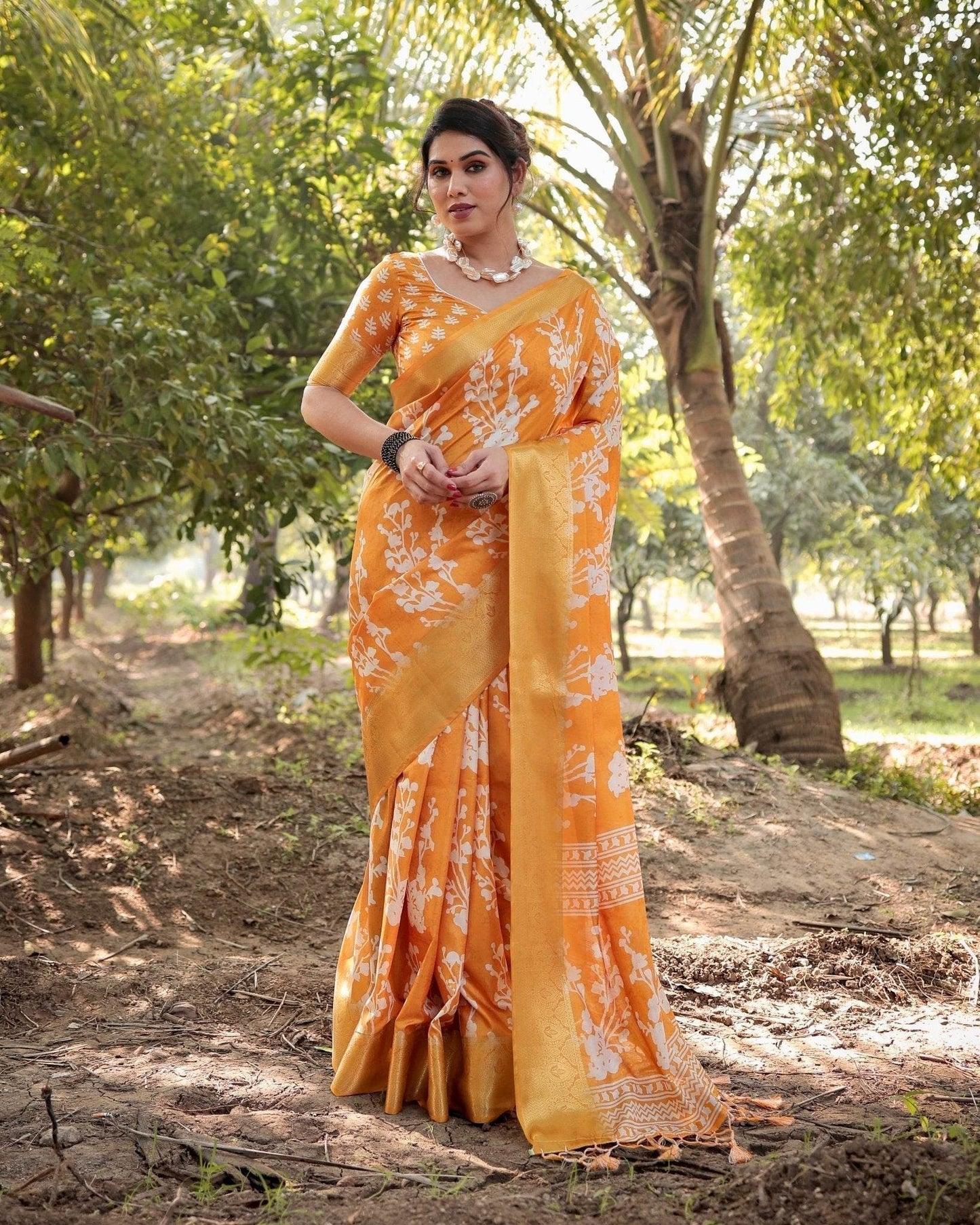 Sunshine Yellow Tussar Silk Saree with White Floral Motifs, Lustrous Zari Border, and Graceful Tassel Pallu - SEEANS