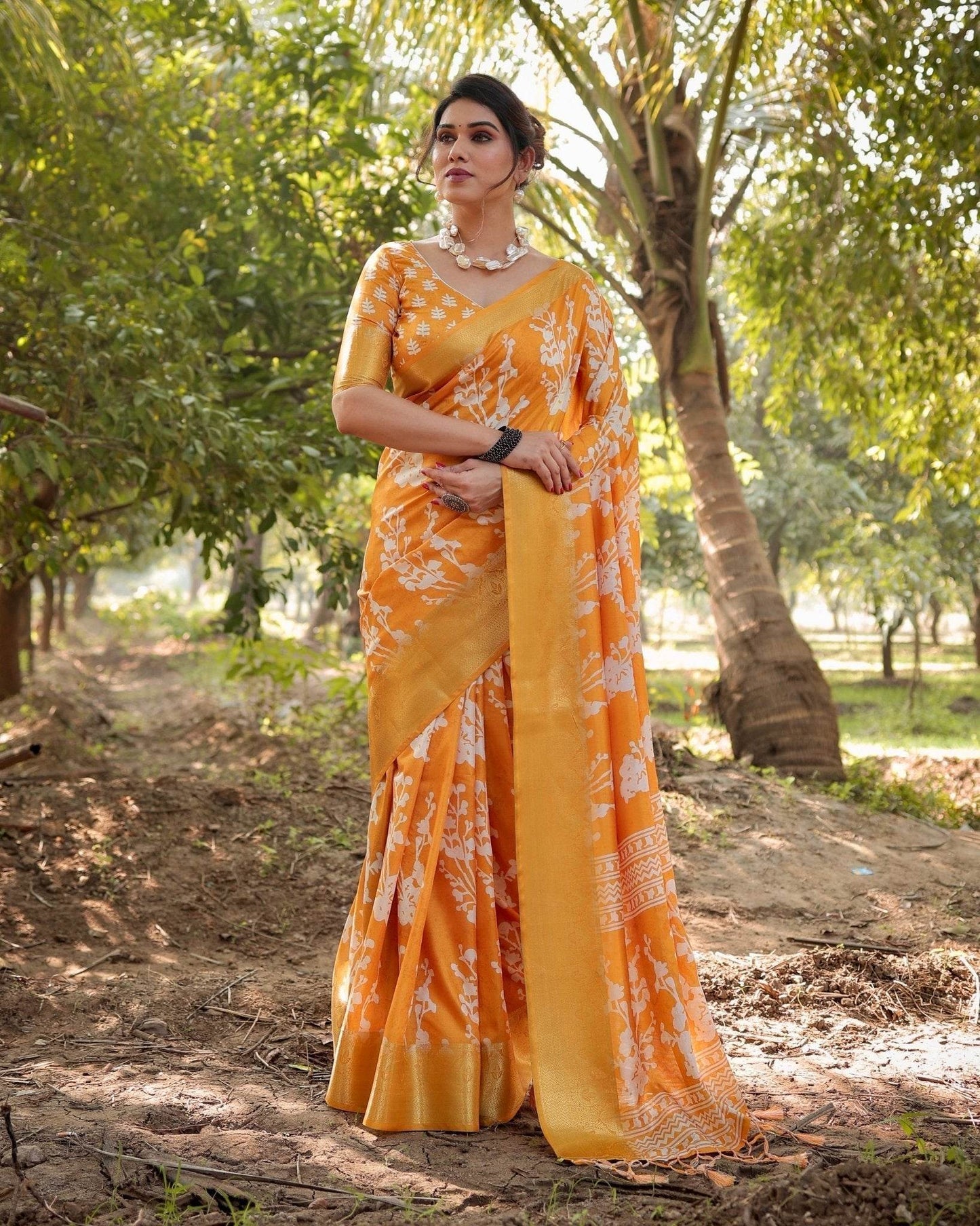 Sunshine Yellow Tussar Silk Saree with White Floral Motifs, Lustrous Zari Border, and Graceful Tassel Pallu - SEEANS