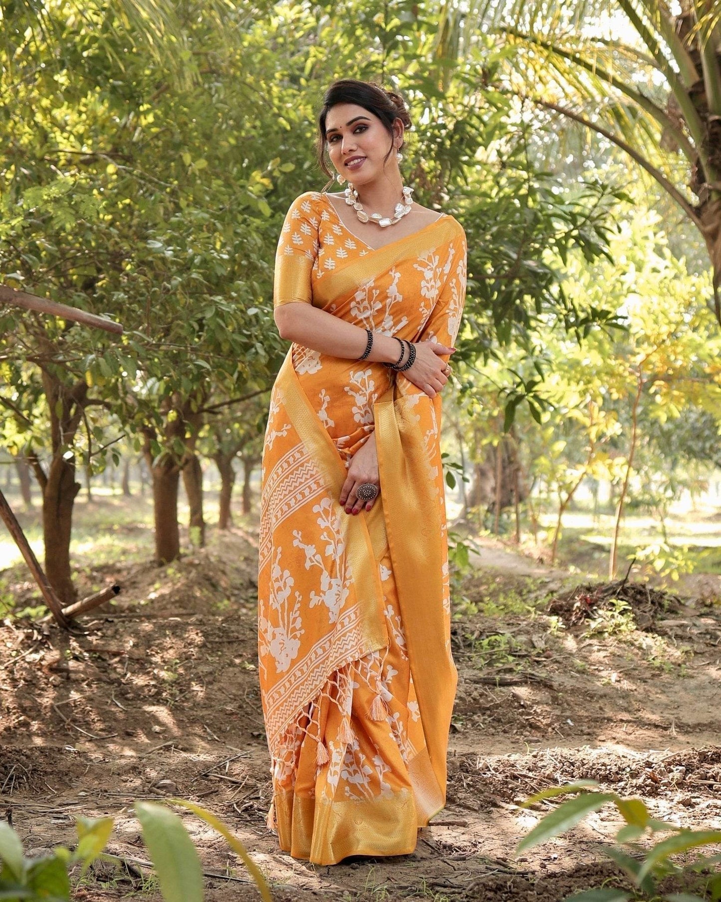 Sunshine Yellow Tussar Silk Saree with White Floral Motifs, Lustrous Zari Border, and Graceful Tassel Pallu - SEEANS