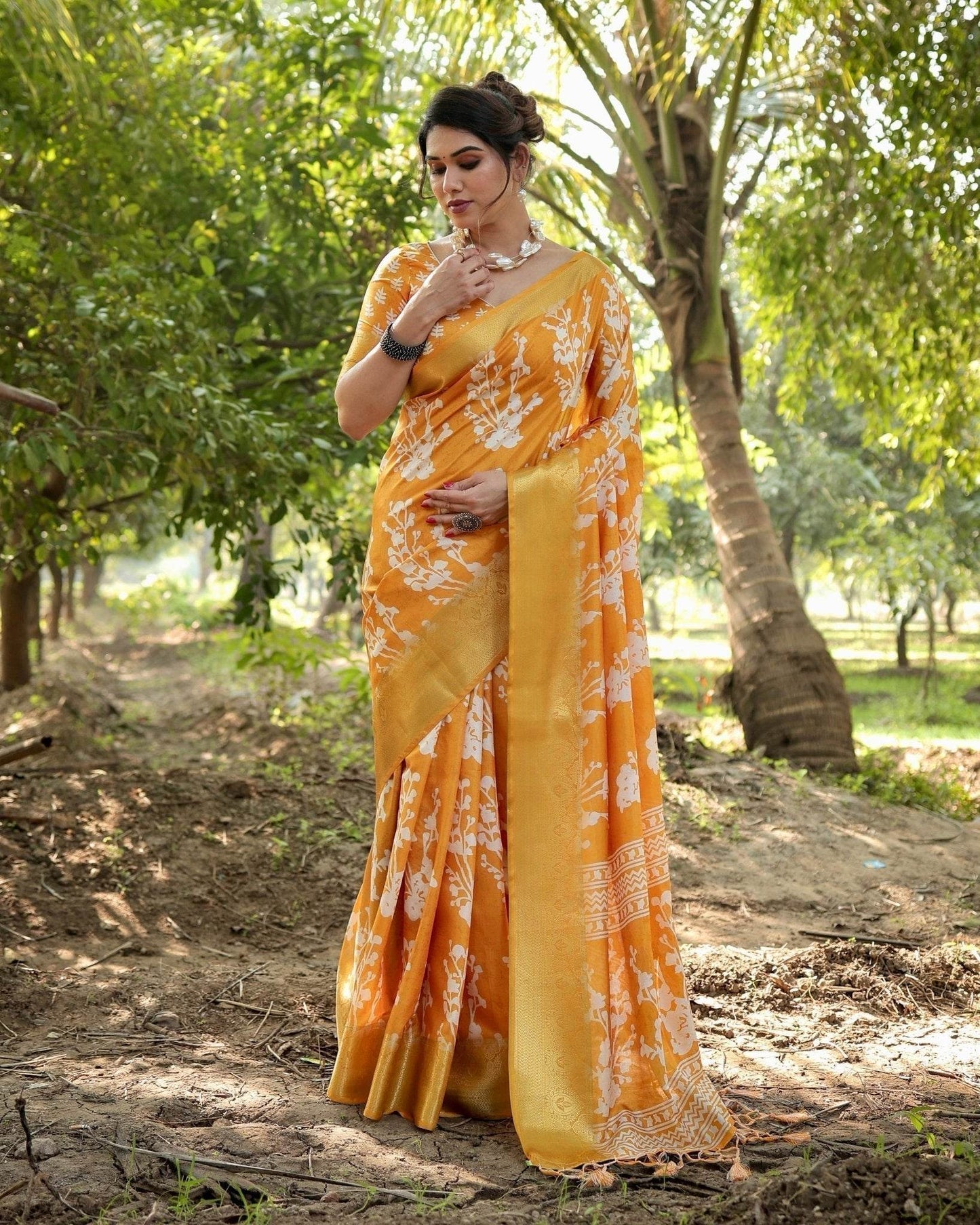Sunshine Yellow Tussar Silk Saree with White Floral Motifs, Lustrous Zari Border, and Graceful Tassel Pallu - SEEANS