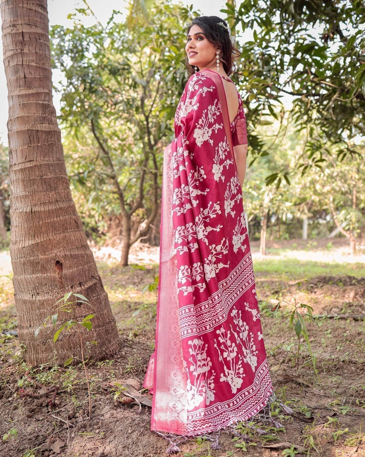 Maroon Tussar Silk Saree with White Floral Motifs, Intricate Zari Border, and Elegant Tassel Pallu - SEEANS