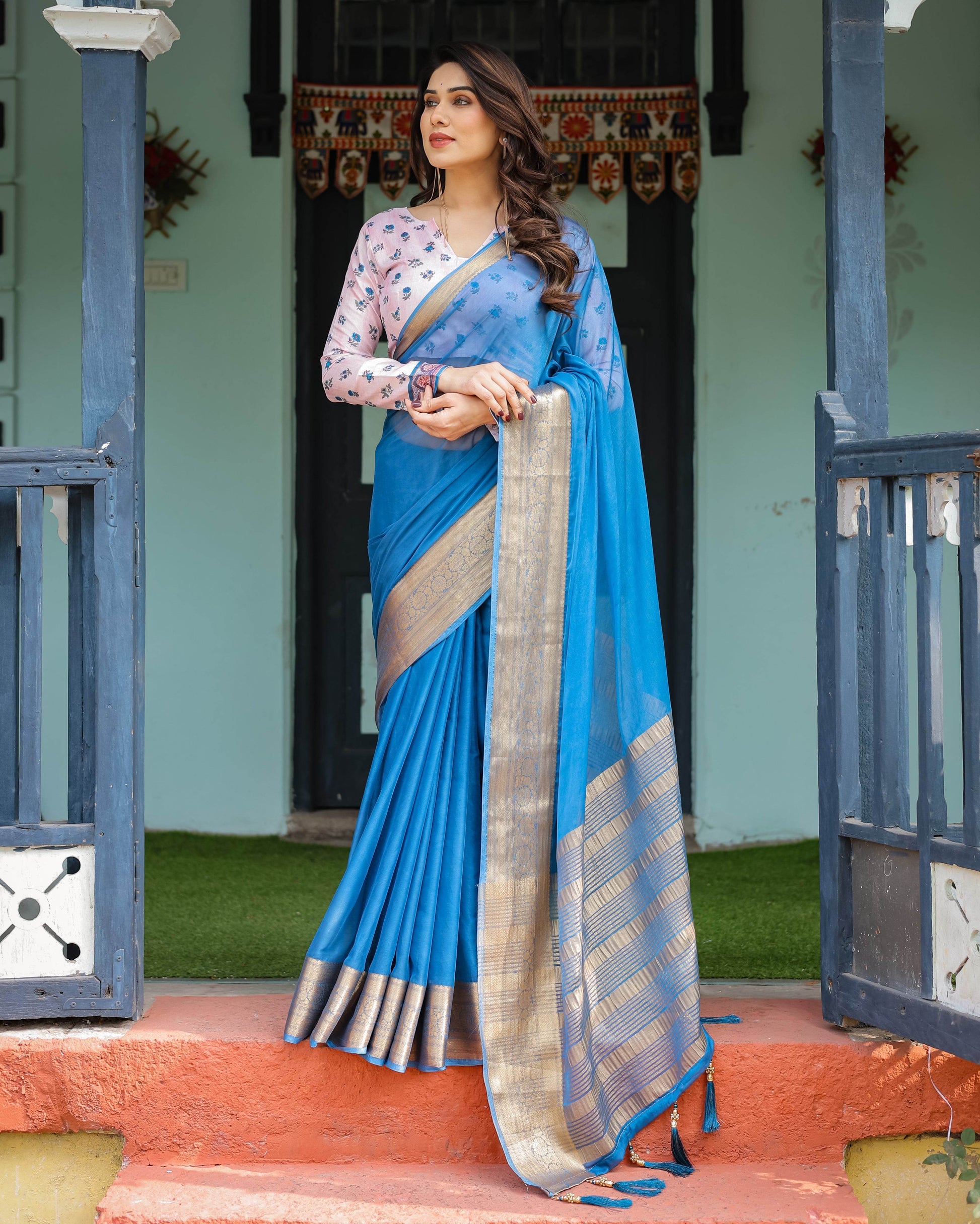 Vibrant Sky Blue Plain Chiffon Saree with Gold Zari Border, Floral Printed Blouse & Tassel Accents - SEEANS