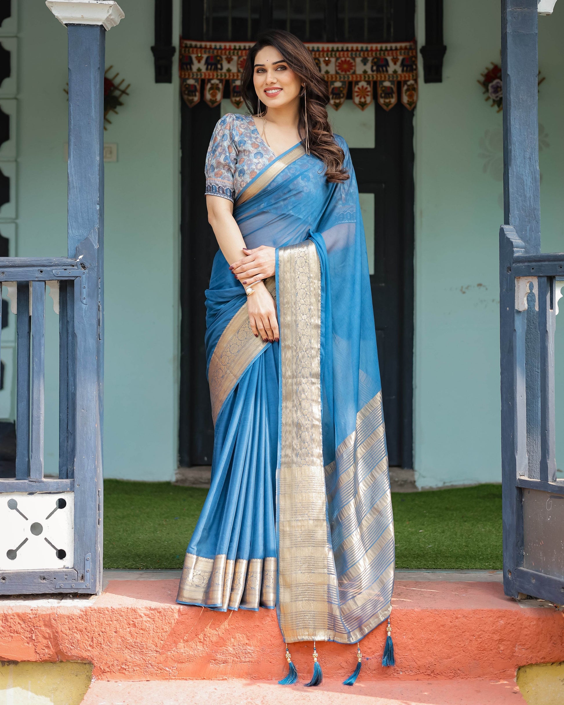 Vibrant Peacock Blue Plain Chiffon Saree with Gold Zari Border, Floral Printed Blouse & Tassel Accents - SEEANS