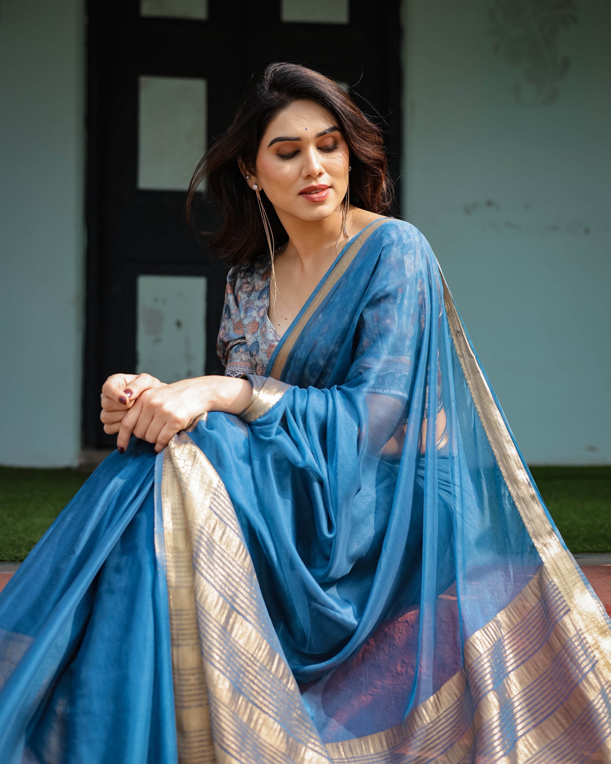 Vibrant Peacock Blue Plain Chiffon Saree with Gold Zari Border, Floral Printed Blouse & Tassel Accents - SEEANS