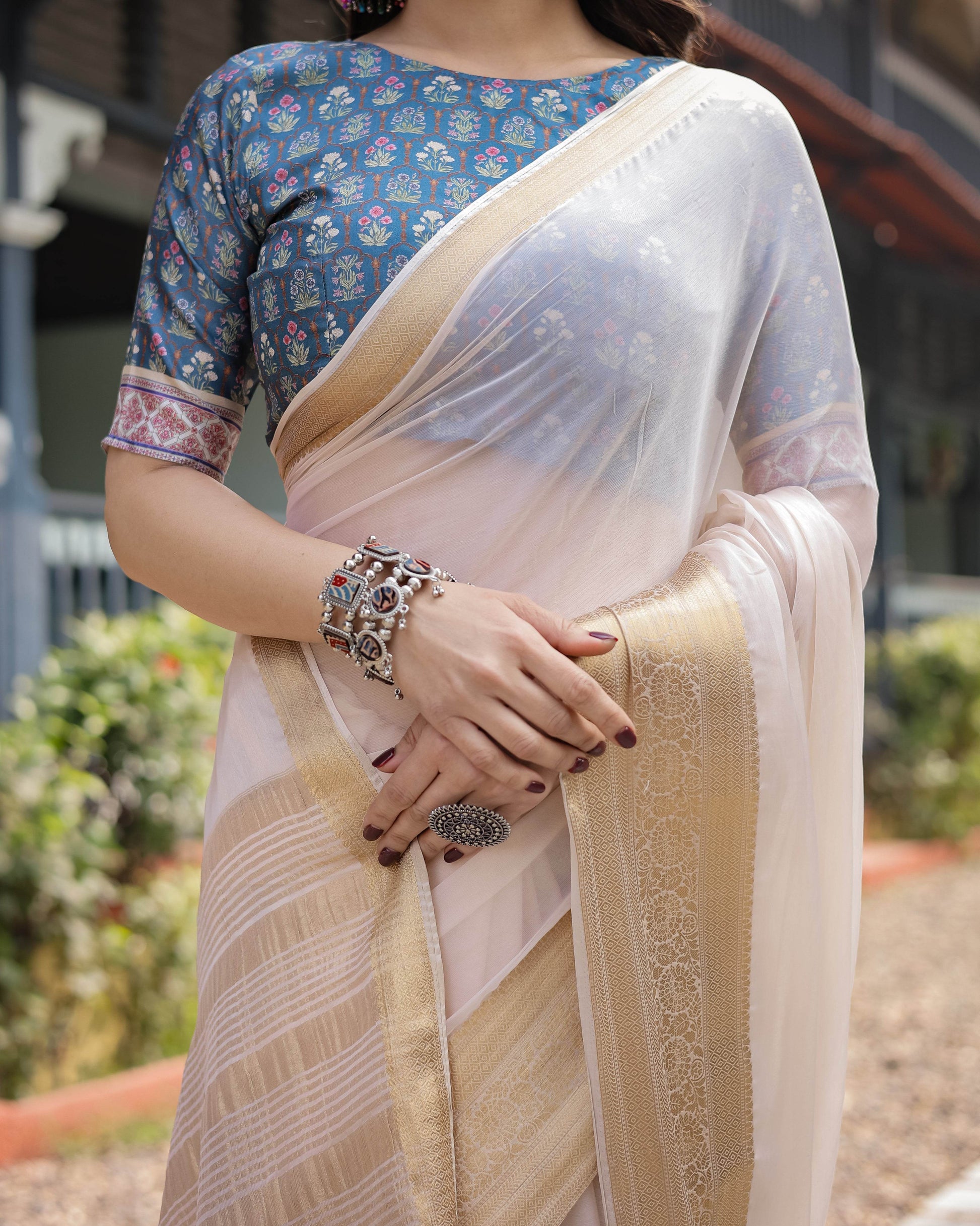 Ivory White Plain Chiffon Saree with Gold Zari Border, Floral Printed Blouse & Tassel Detailing - SEEANS