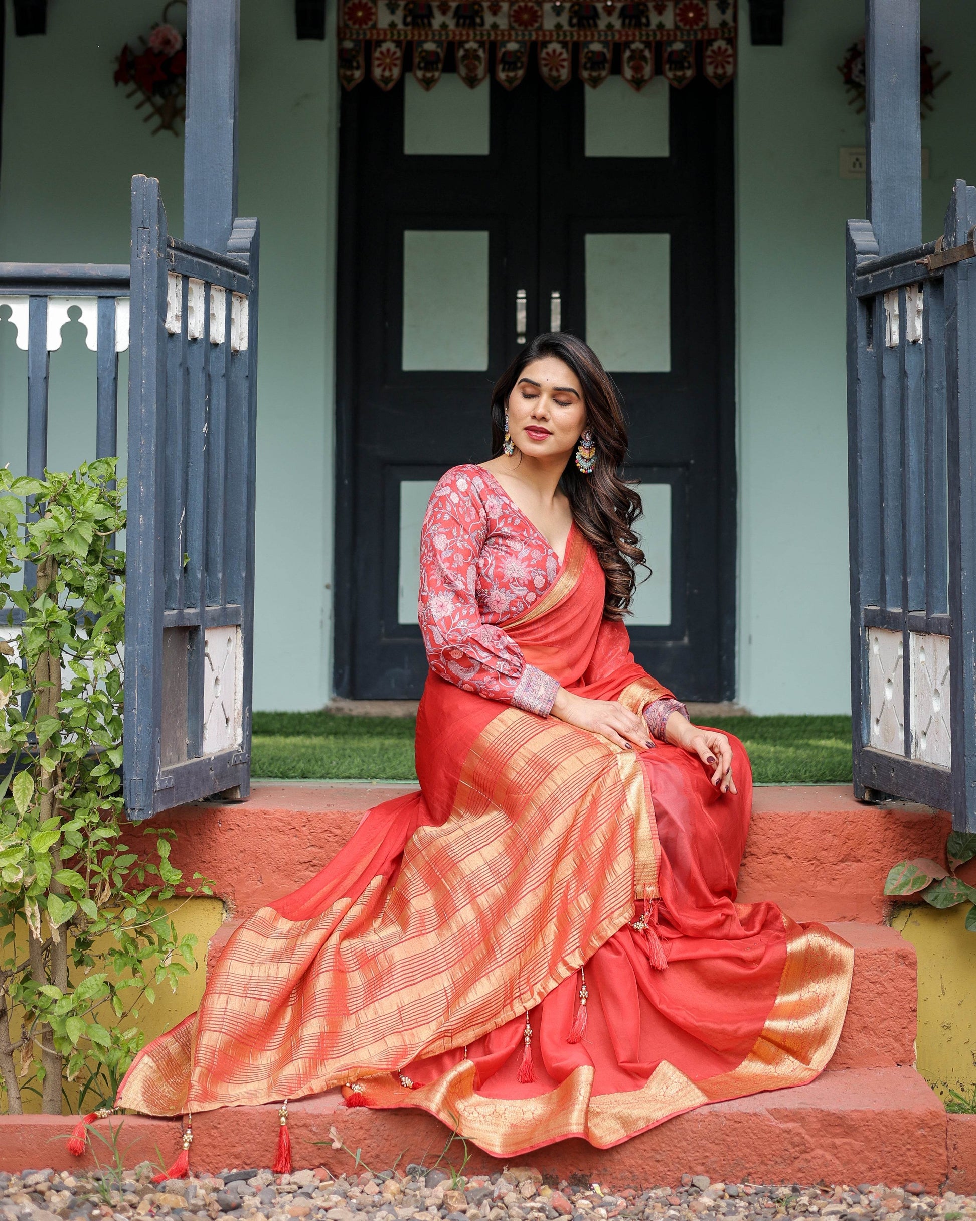 Fiery Red Plain Chiffon Saree with Gold Zari Border, Full-Sleeve Floral Blouse & Tassel Detailing - SEEANS