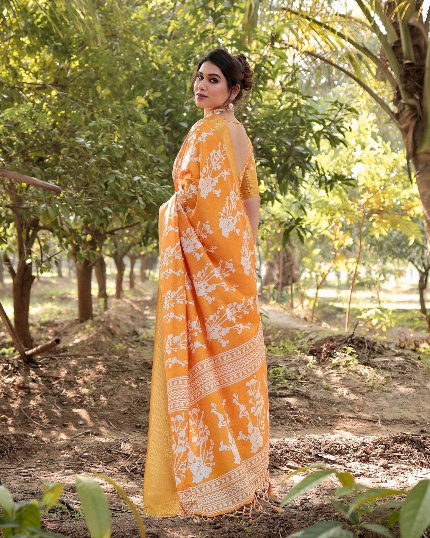 Sunshine Yellow Tussar Silk Saree with White Floral Motifs, Lustrous Zari Border, and Graceful Tassel Pallu - SEEANS