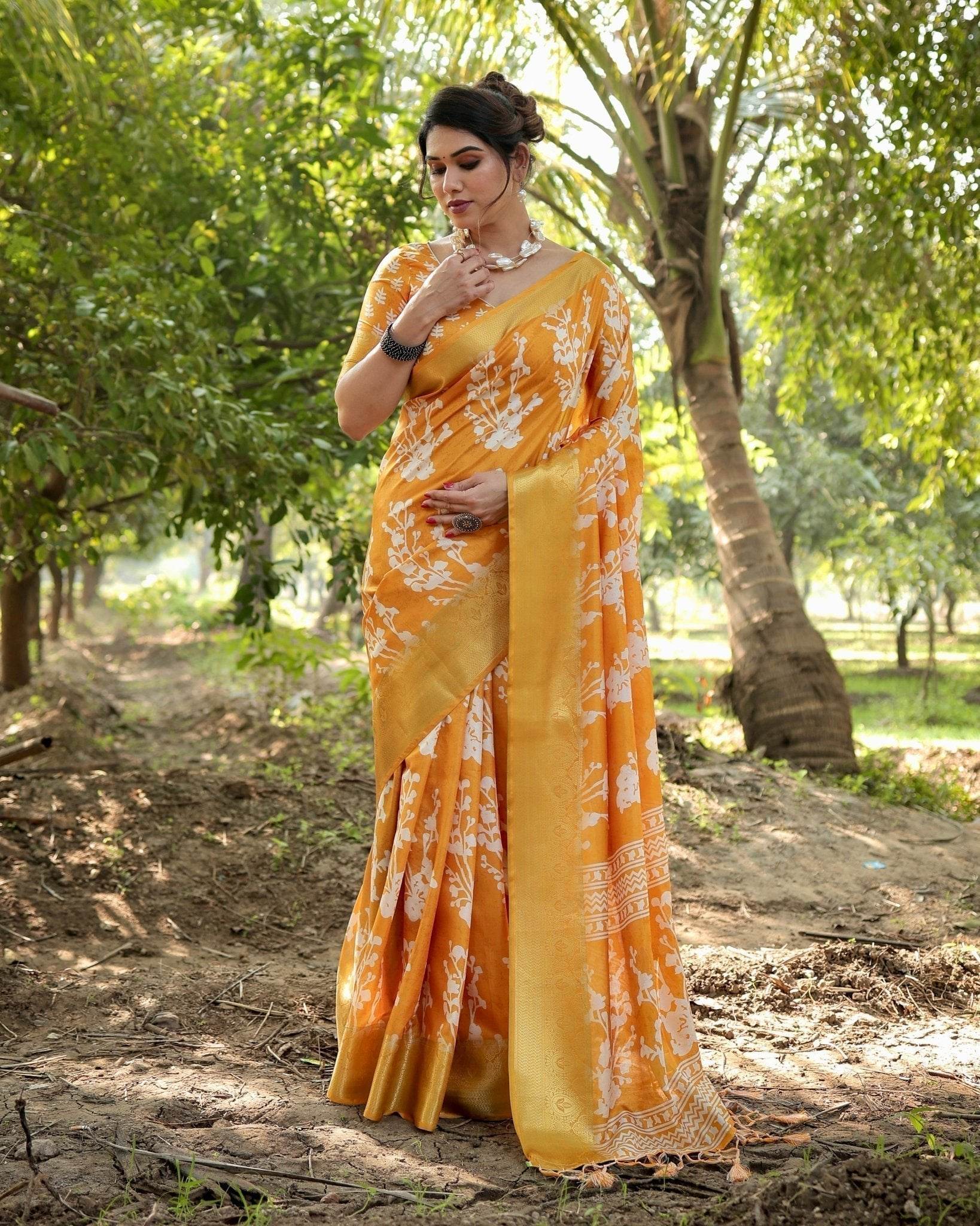 Sunshine Yellow Tussar Silk Saree with White Floral Motifs, Lustrous Zari Border, and Graceful Tassel Pallu - SEEANS